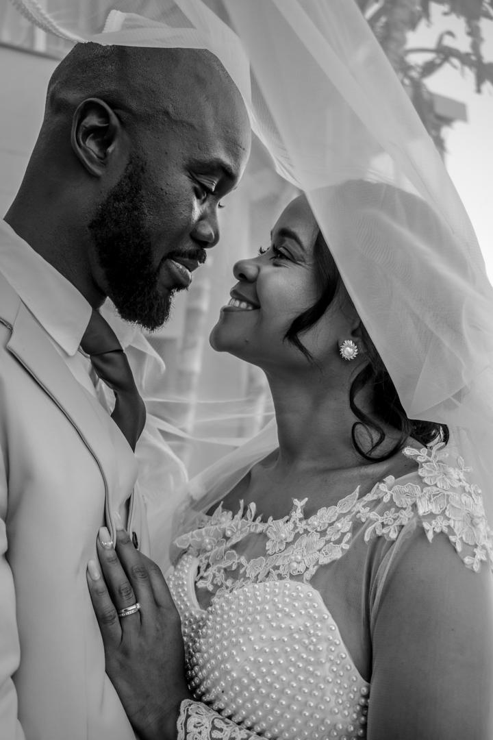 A candid portrait of a woman laughing in a field